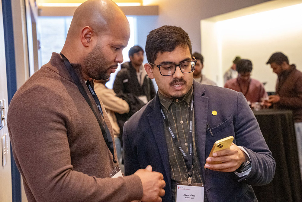 Dan Lloyd Talking to Wolf Den Attendee